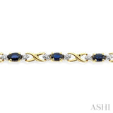 5x3 MM Oval Cut Sapphire and 1/10 Ctw Single Cut Diamond Bracelet in 10K Yellow Gold